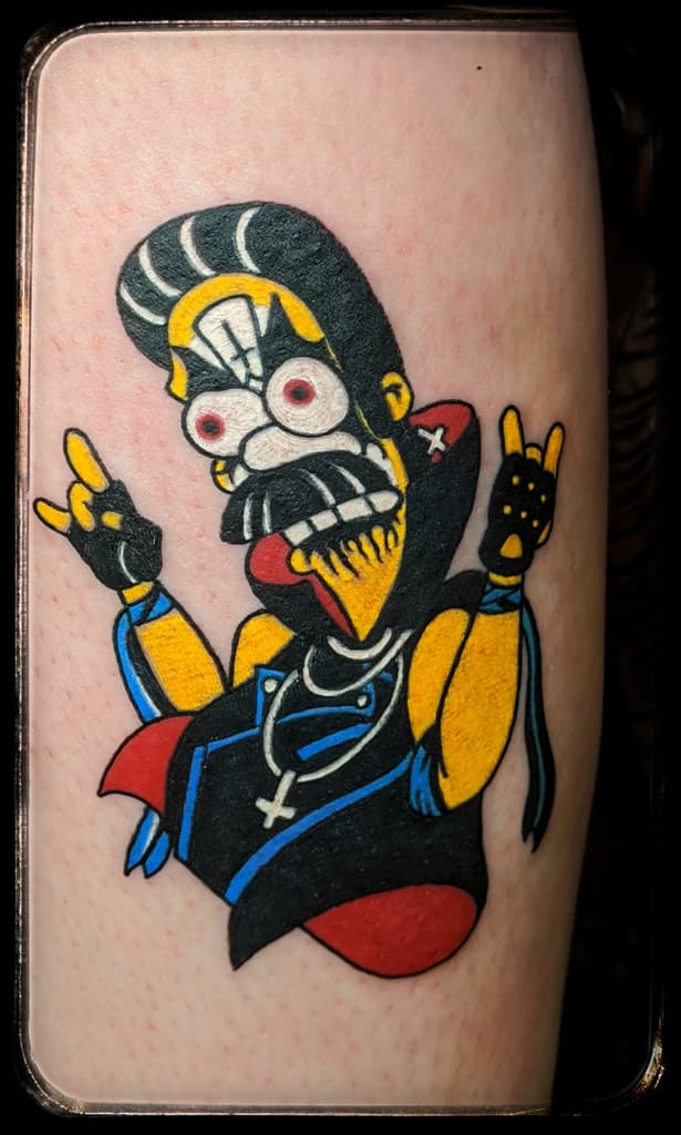Yellow-skinned cartoon character in black-and-white corpse paint and a leather vest, throwing devil horns, bold colour